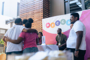 coworkers supporting eachother during the jobfair by careerhub